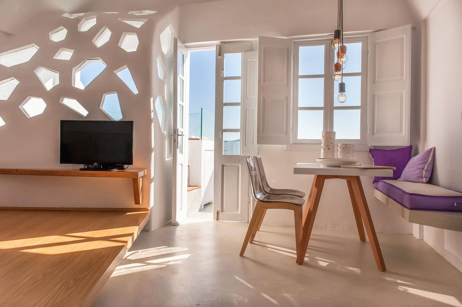 Natural light flooding a luxury suite with premium island design