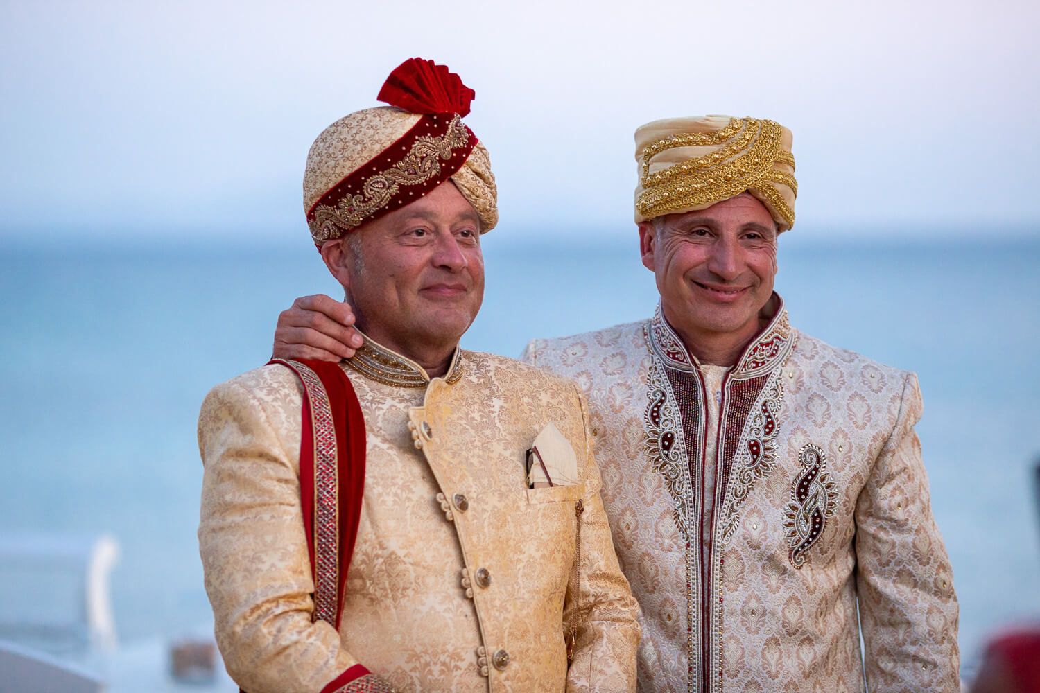 Multicultural wedding dinner setup right by the sea in Greece
