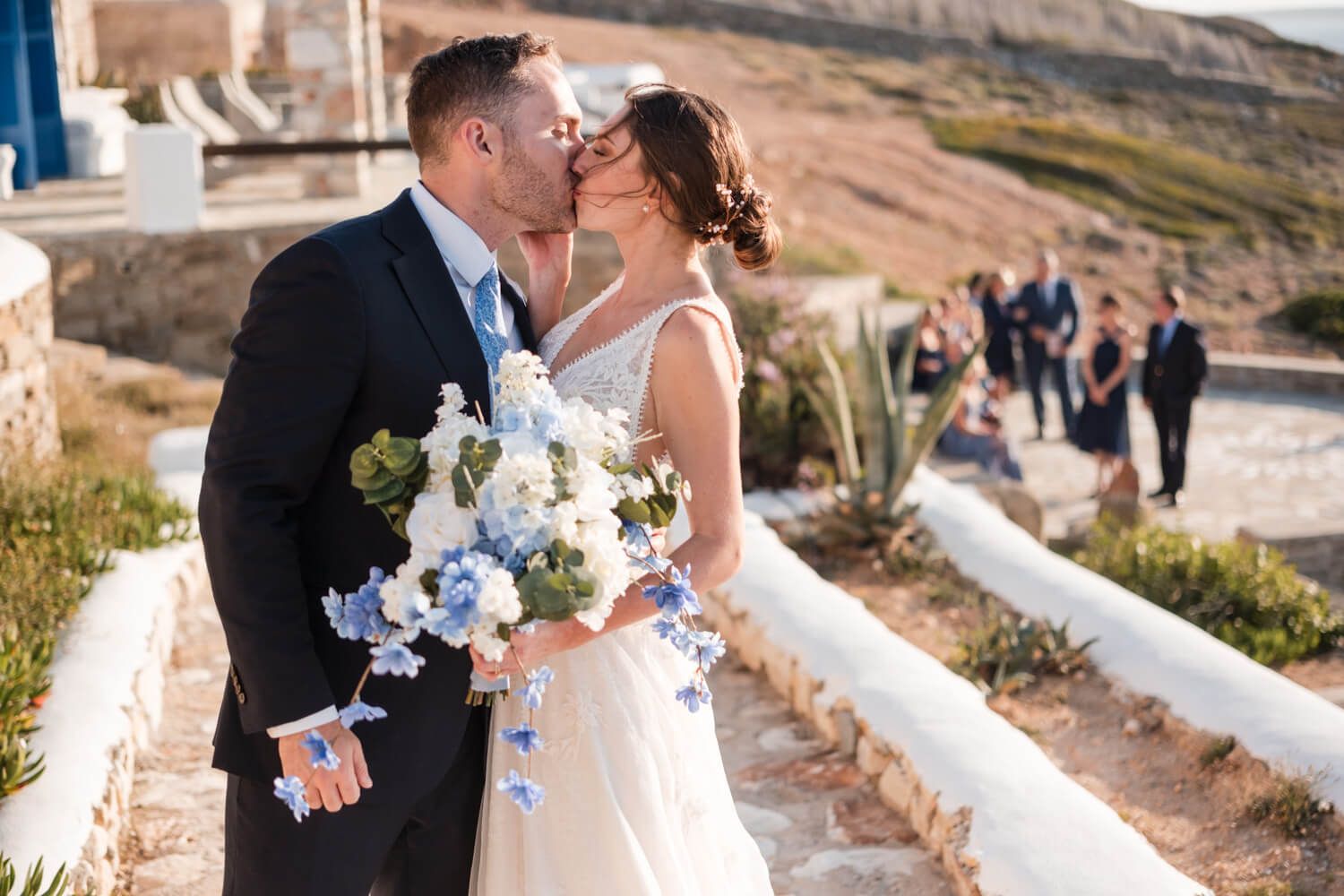 Newlyweds sharing their first kiss as husband and wife at a luxury villa