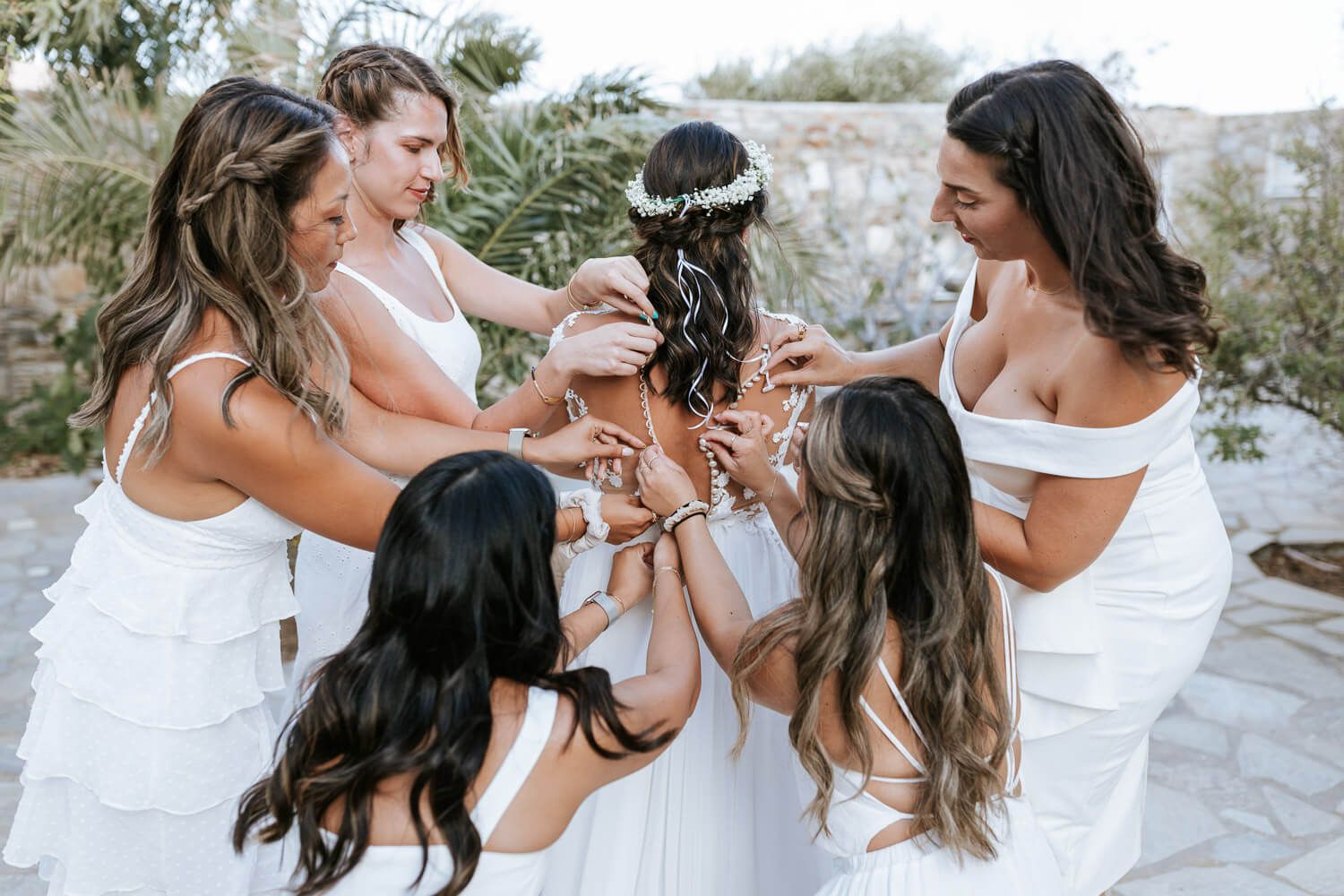 Bride with her mother and friends in traditional house