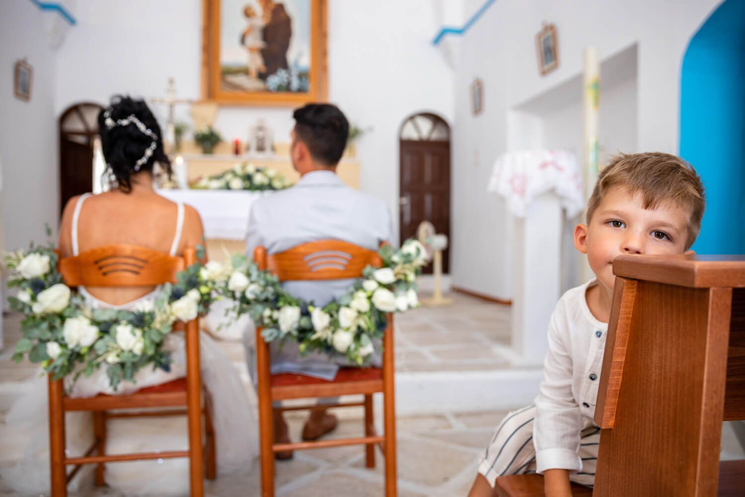Emotional moment of the bride's son looking attending the wedding ceremony