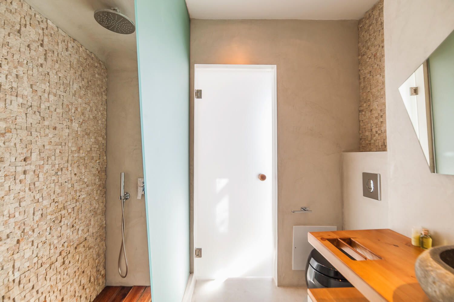 Built-in Cycladic shower architecture in a luxury Santorini hotel