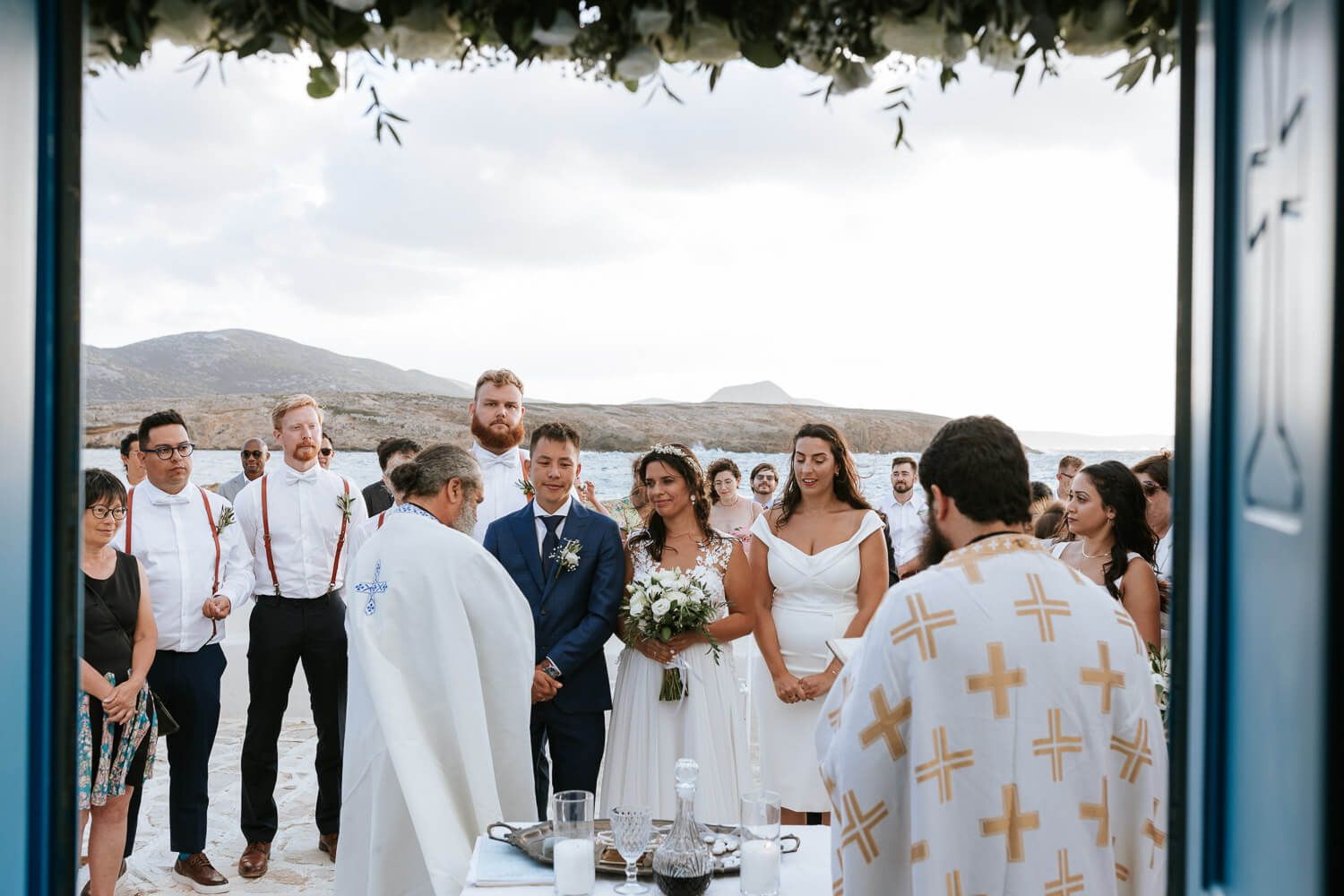 Guests watching the ceremony with sea view background