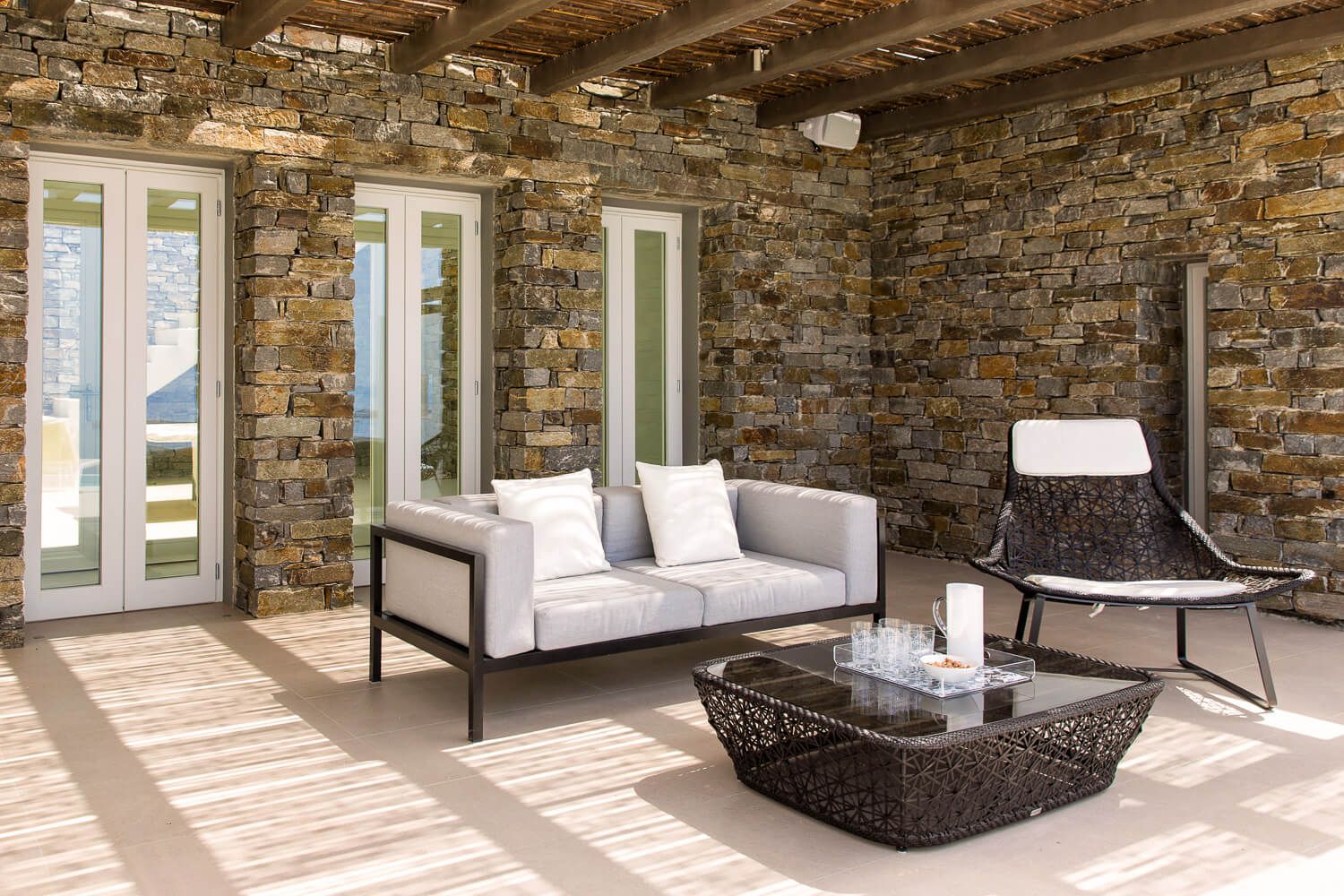 Premium outdoor furniture selection overlooking the Aegean Sea