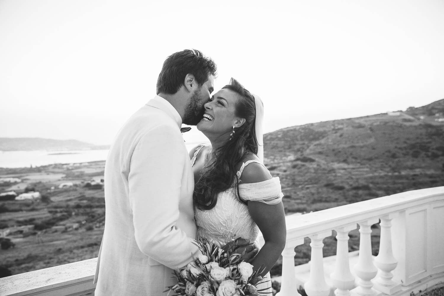 Newlyweds posing after their Jewish wedding ceremony in Greece
