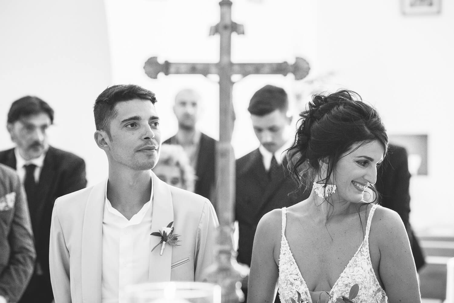 Candid black and white shot of the newlyweds at the church in Parikia