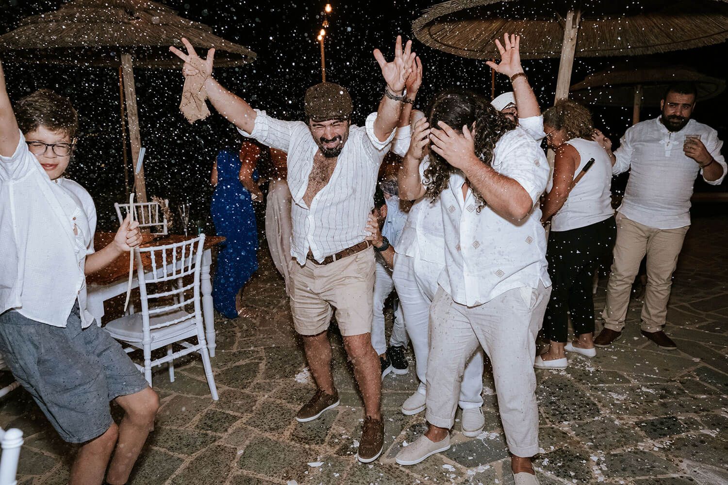 Guests singing and celebrating love at an unforgettable island party