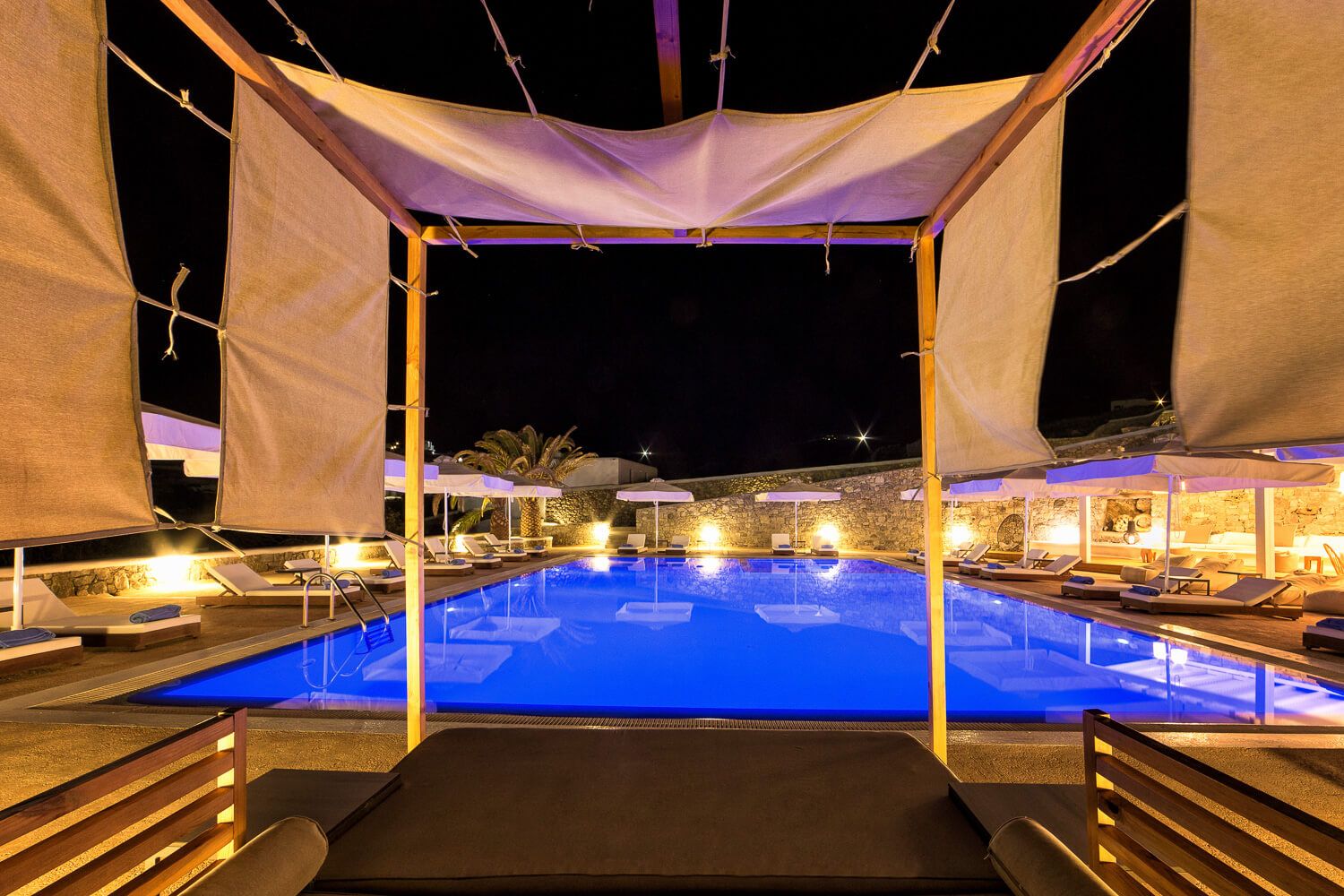 The romantic oasis of Osom Resort illuminated under the night sky