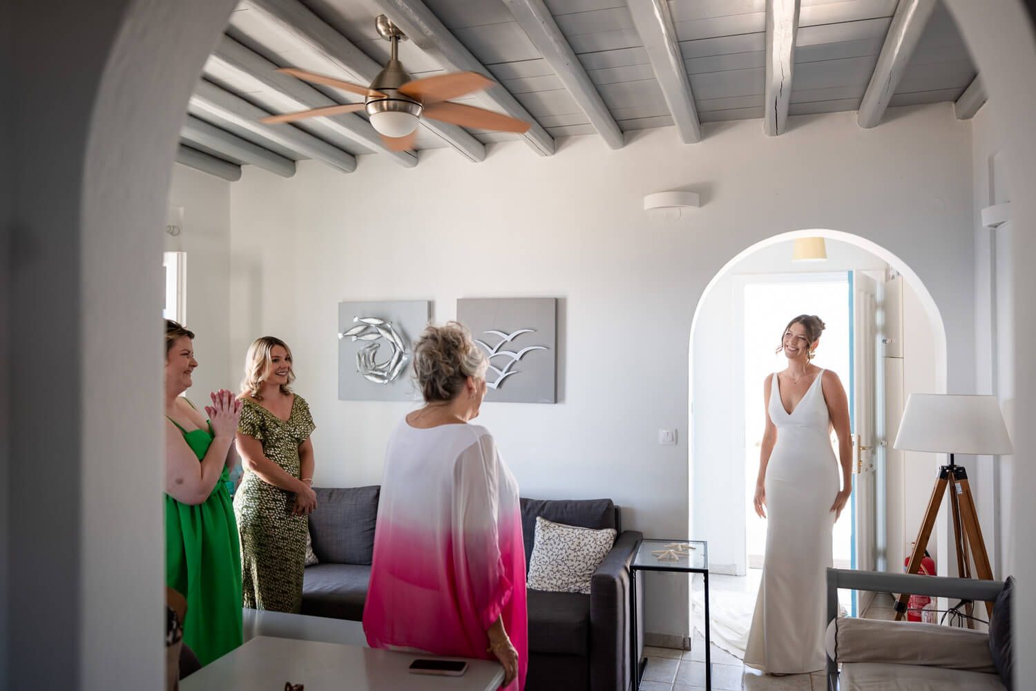 Bride Jess smiling with her bridesmaids during wedding prep in Ambelas