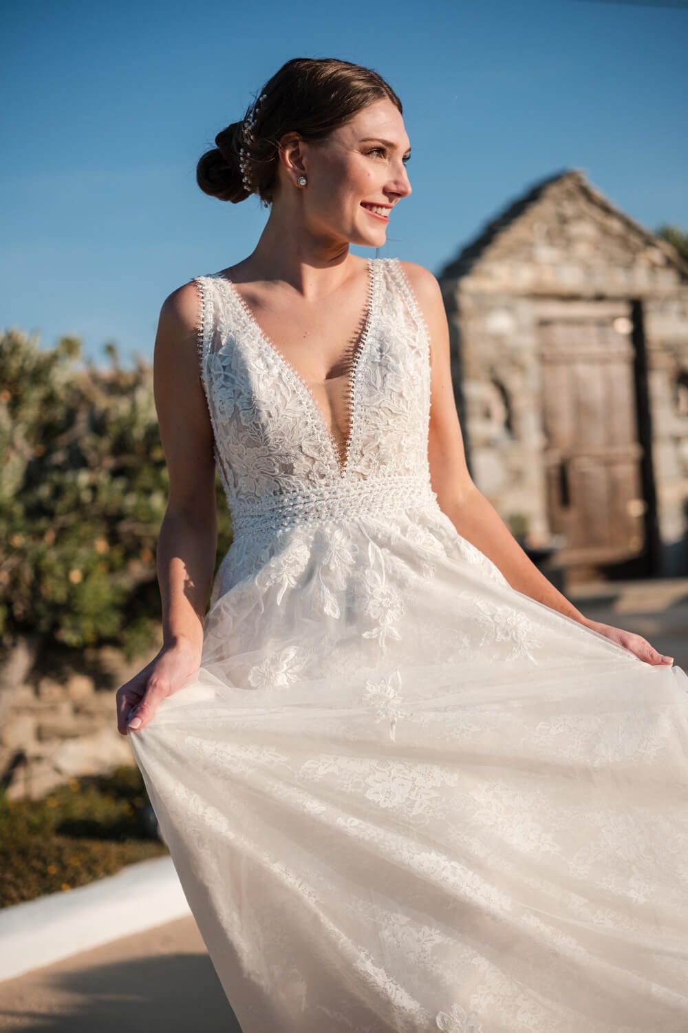 Wind blowing the bride's dress during a romantic couple session