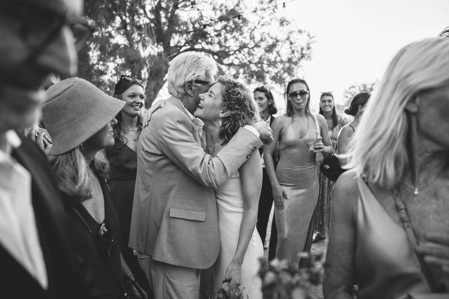 Guests greeting the bride during a wedding reception in Paros Greece.