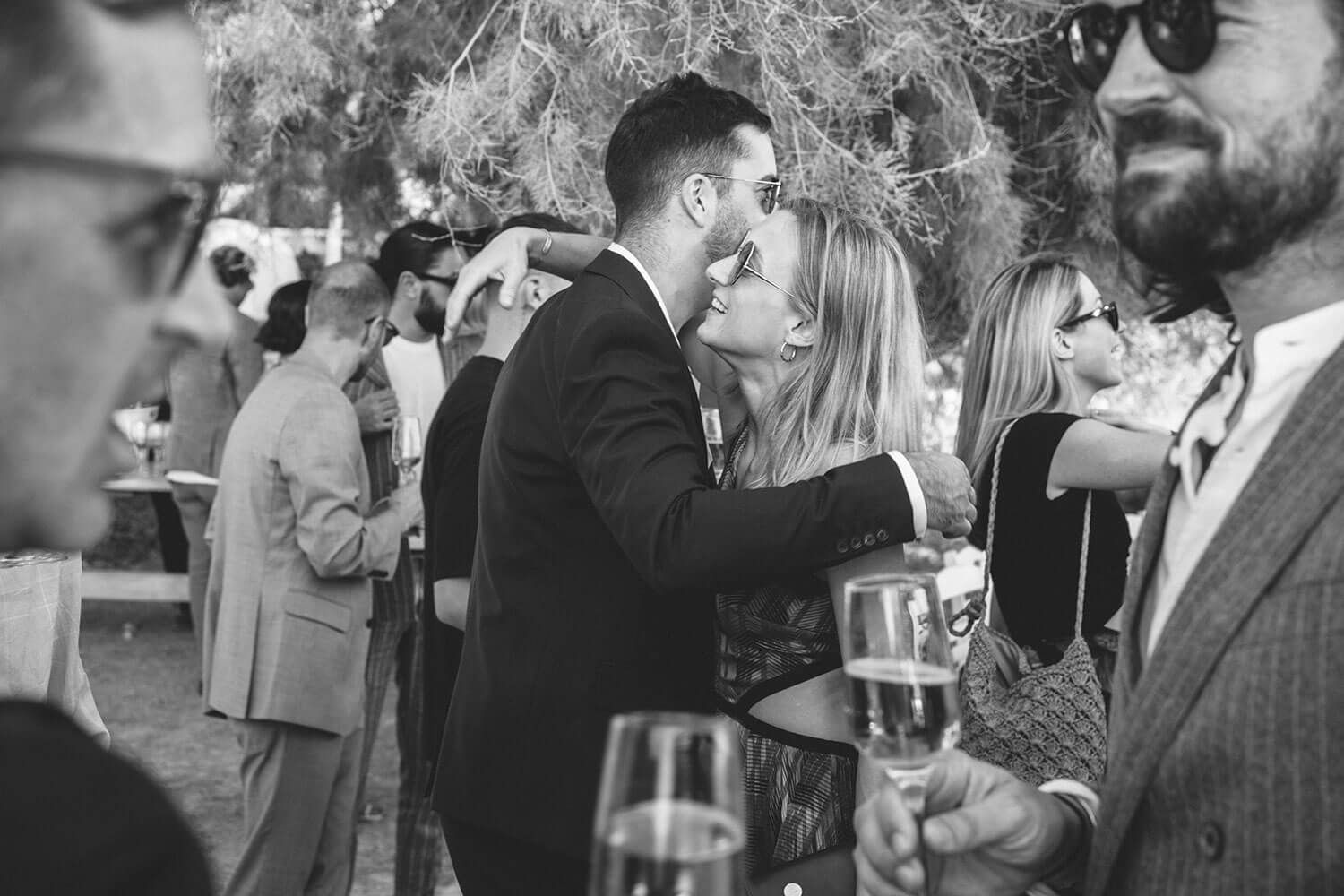 Casual pre-wedding celebration on the sandy beach of Paros island