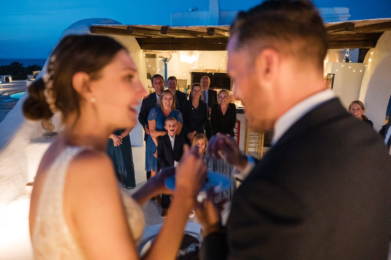 Happy guests laughing and celebrating at a Paros micro wedding