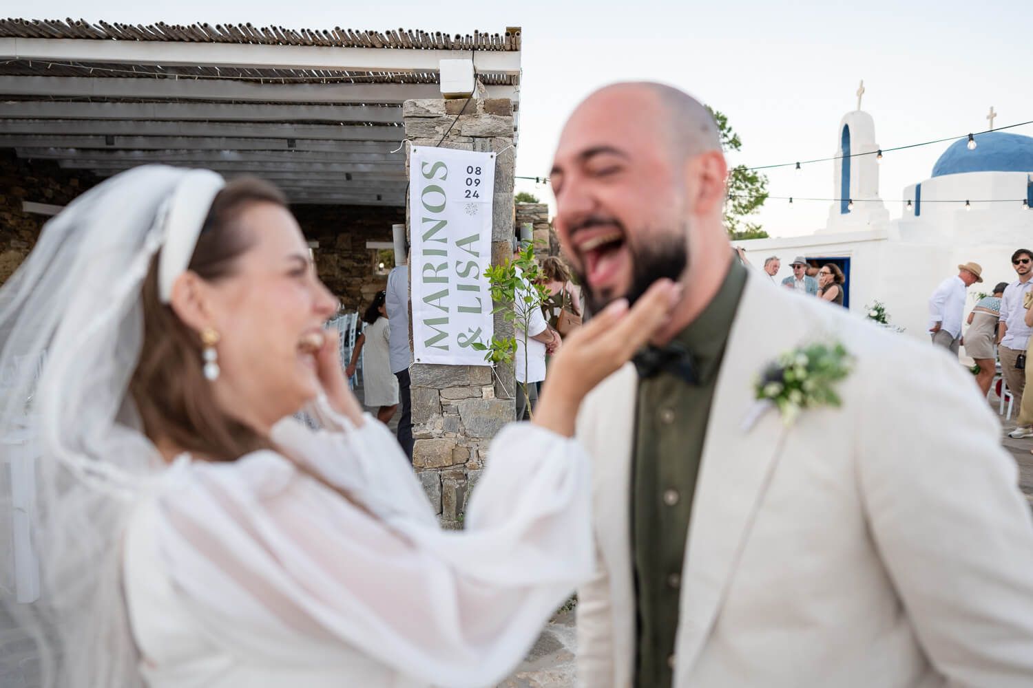 Candid joyful moment of Lisa and Marinos right after their Paros wedding