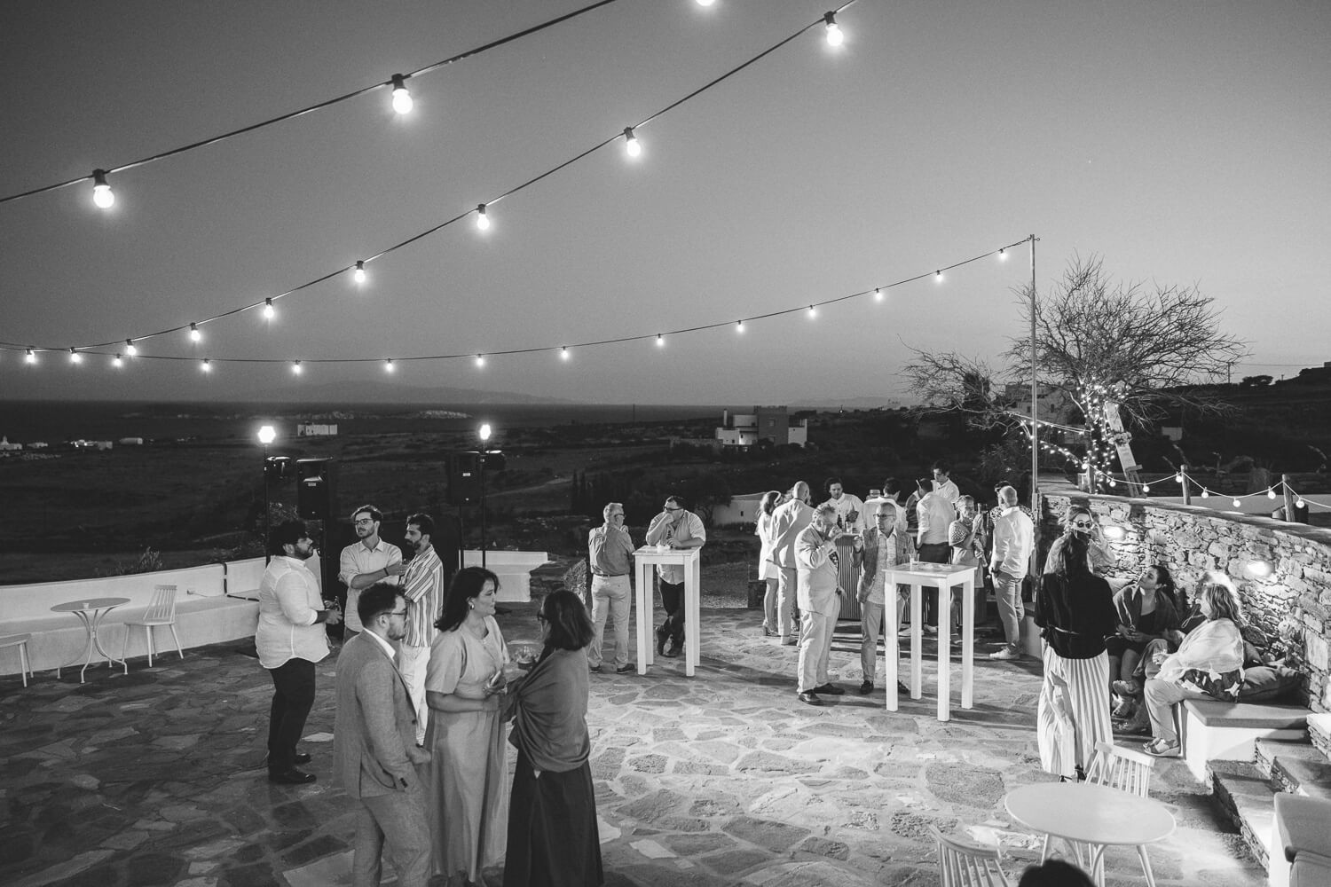 High-energy wedding party starting with traditional Greek island dancing