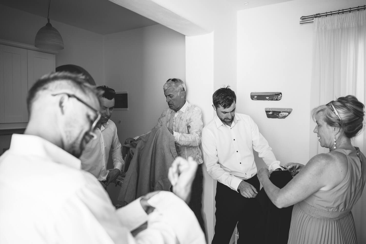 Groom and guests getting ready before wedding in Villa Virginia Paros