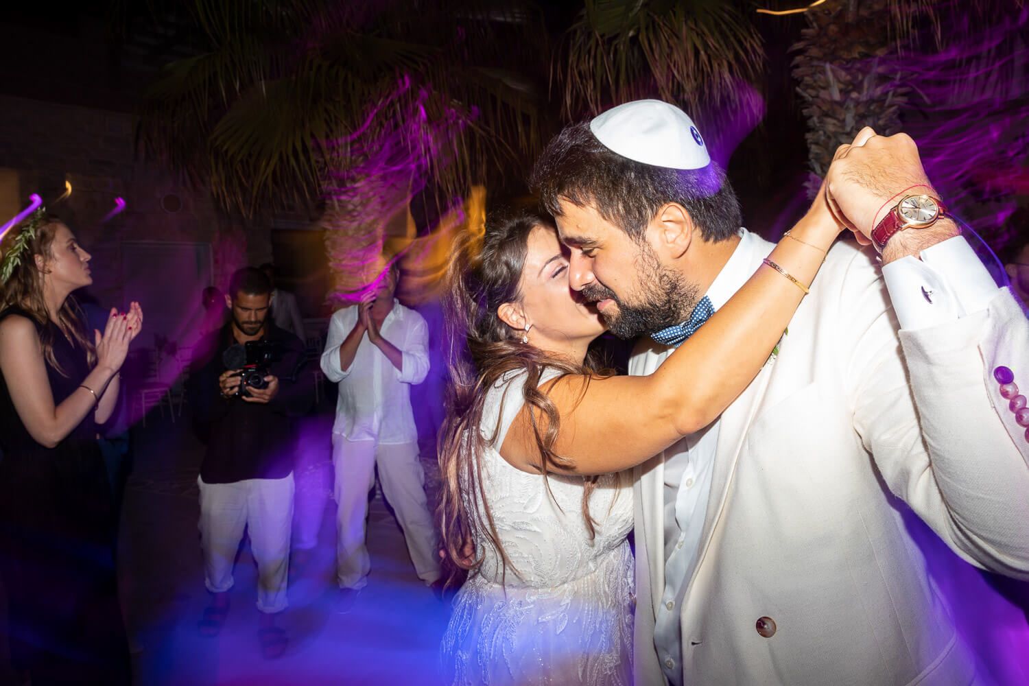 Jewish wedding party at night under the stars in Villa Aethra