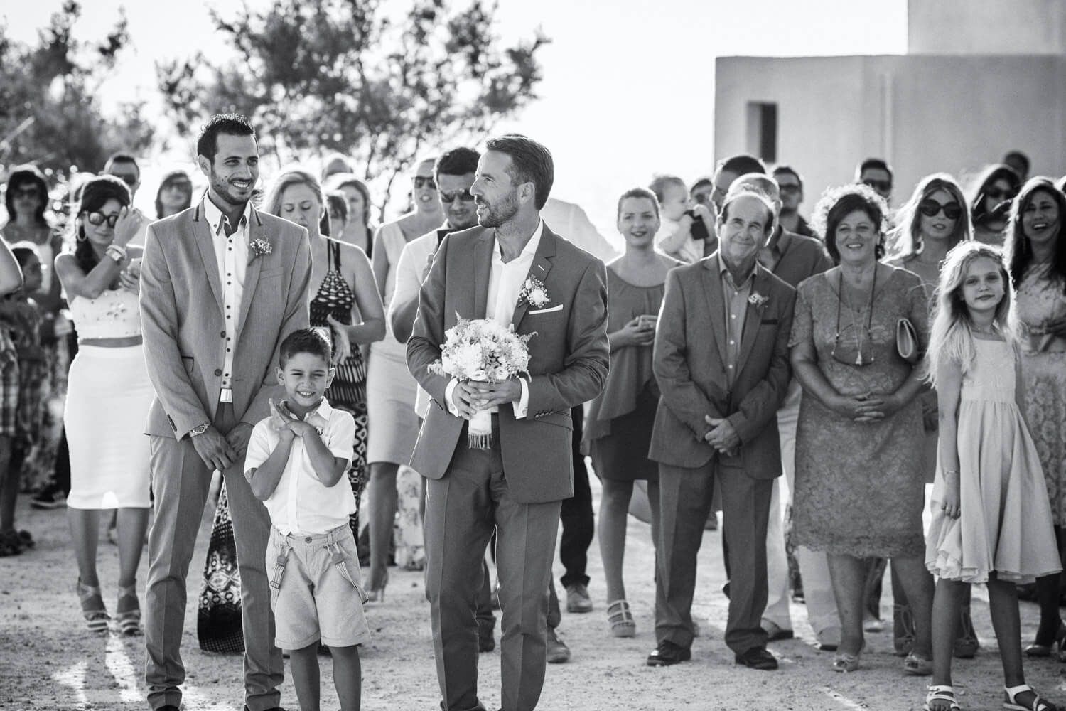 Gromm waiting for the bride at the chrch in Milos island