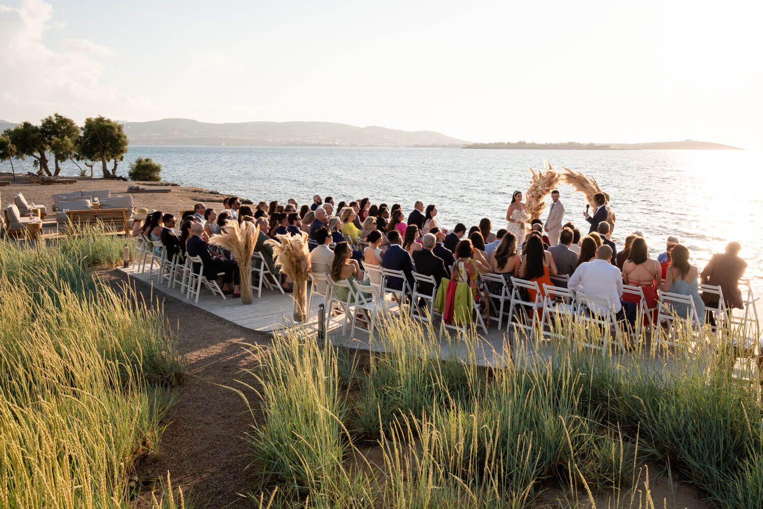 Wide shot of the wedding ceremony setup at Seesoo beachside venue