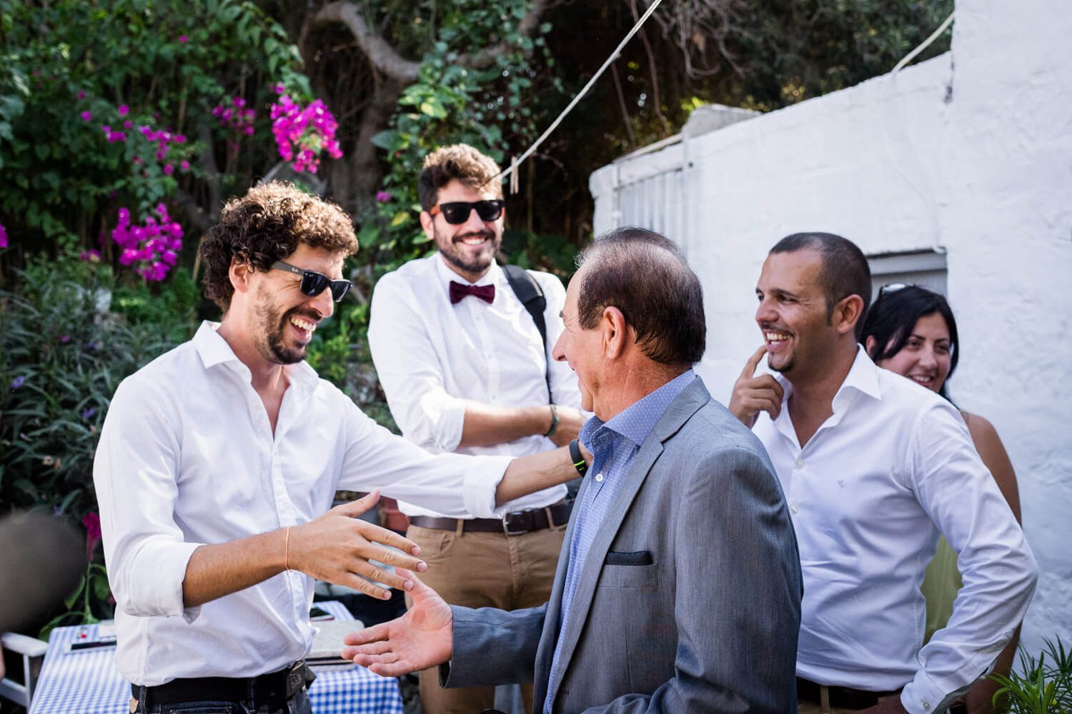 Traditional Greek groom preparation with family and friends