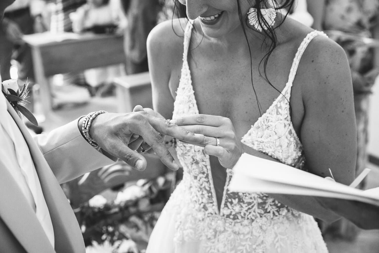 Couple exchanging rings during a Catholic wedding ceremony at St. Antony's church in Paros