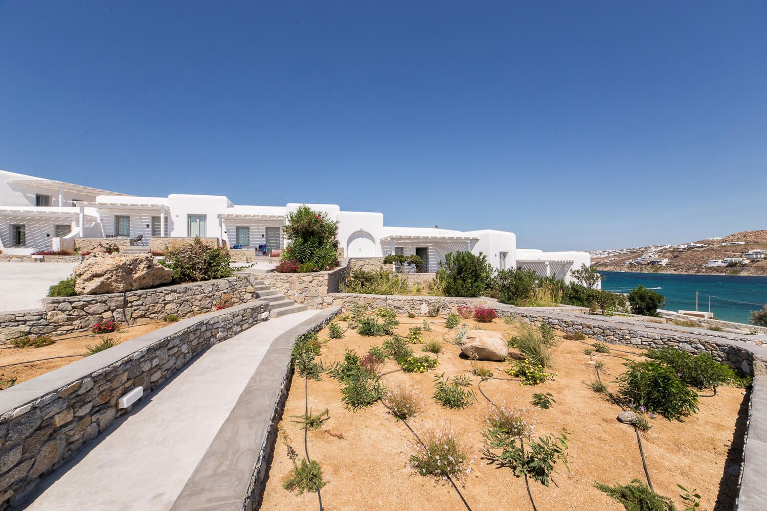 Osom Resort exterior facade and minimalist aesthetic in Korfos