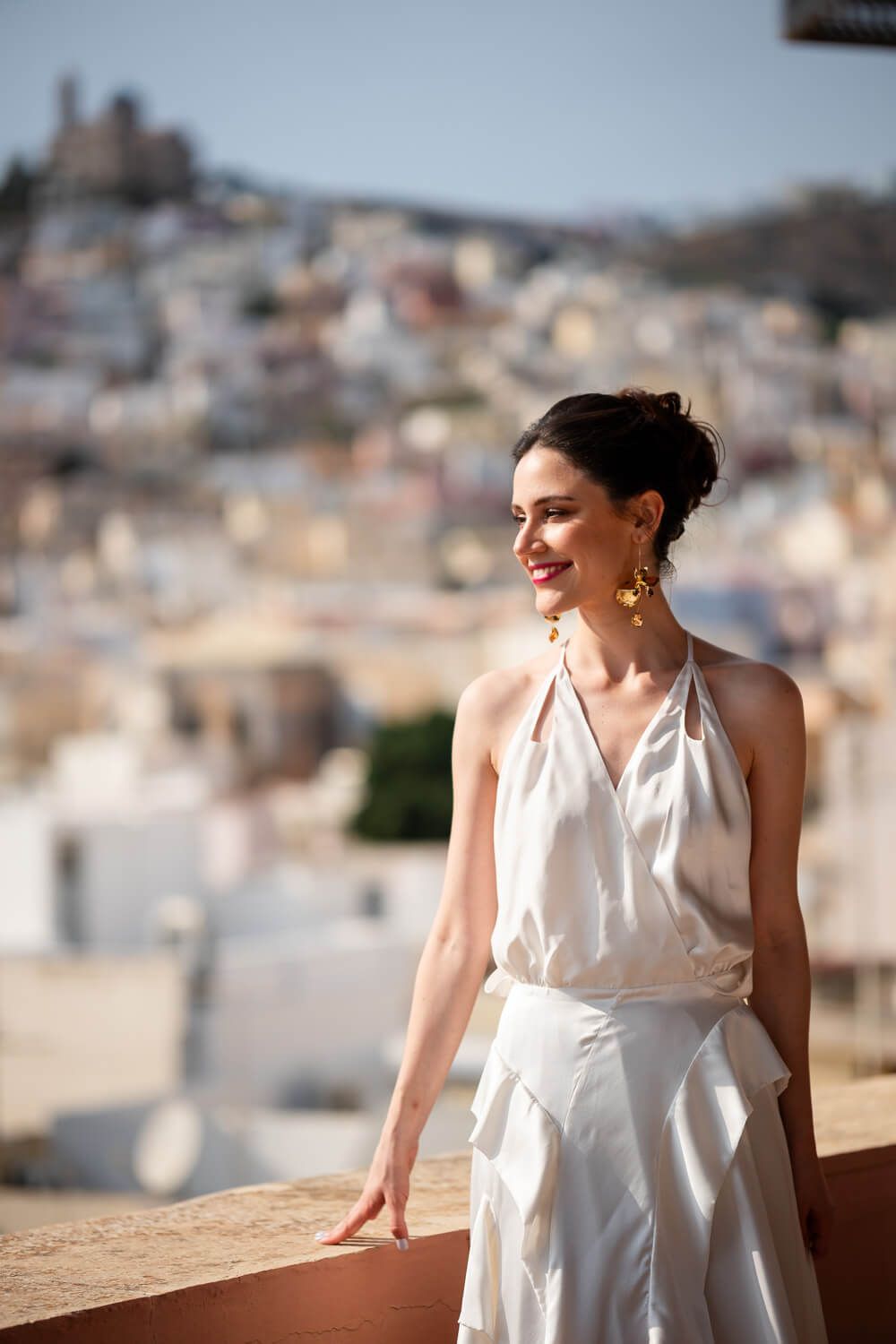 Natural light illuminating the bride in a historic Ermoupolis home