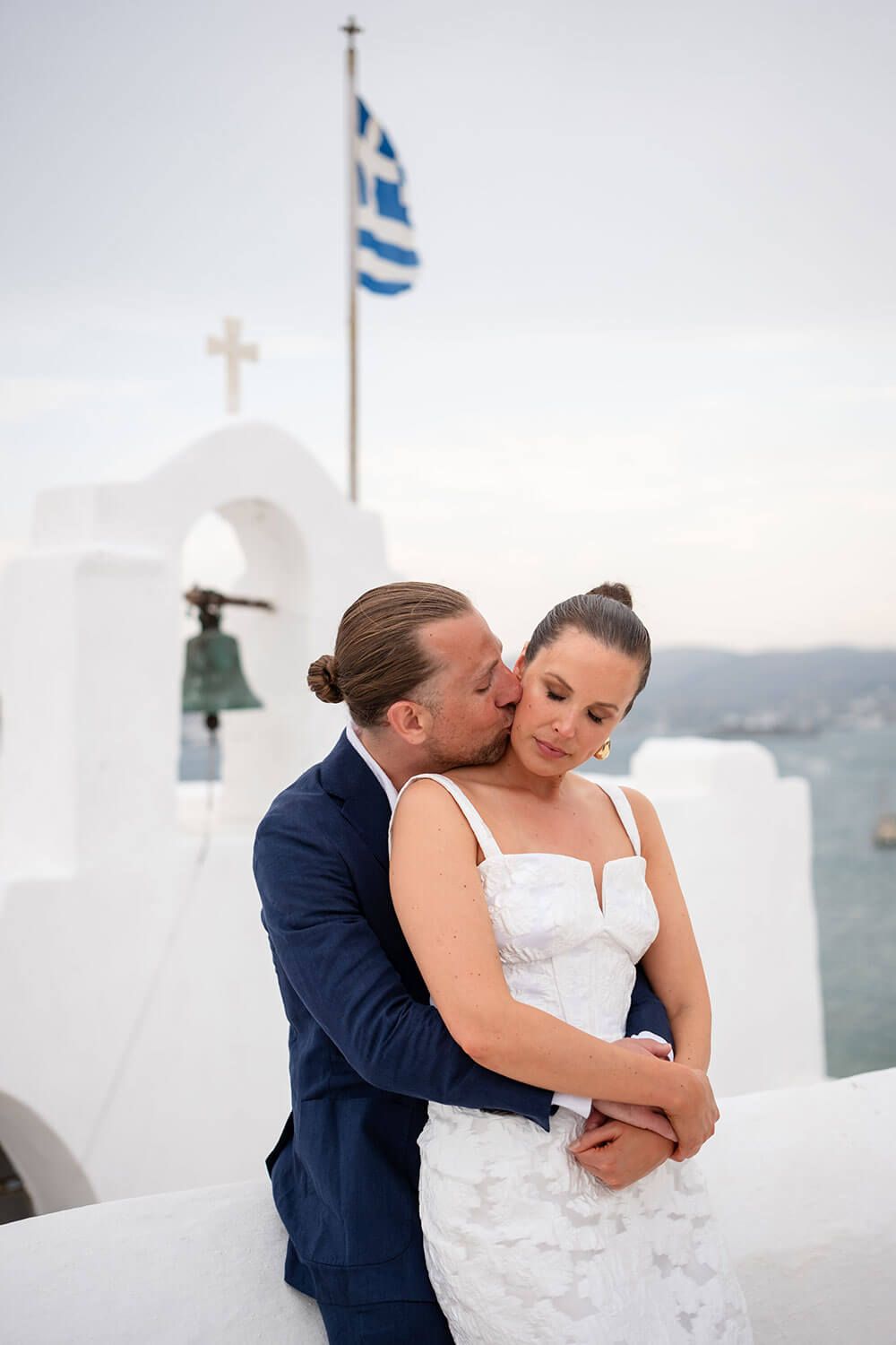 Intimate wedding in Paros: couple relaxing on the rocks at Monastiri