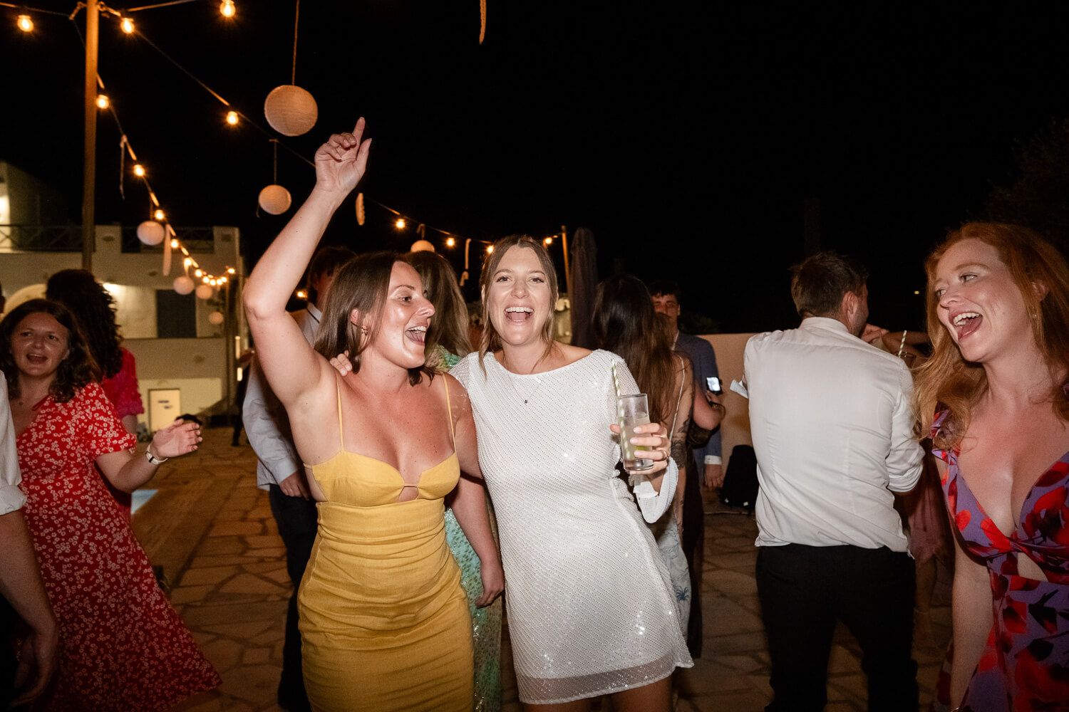 Guests dancing and celebrating at a Greek island destination wedding