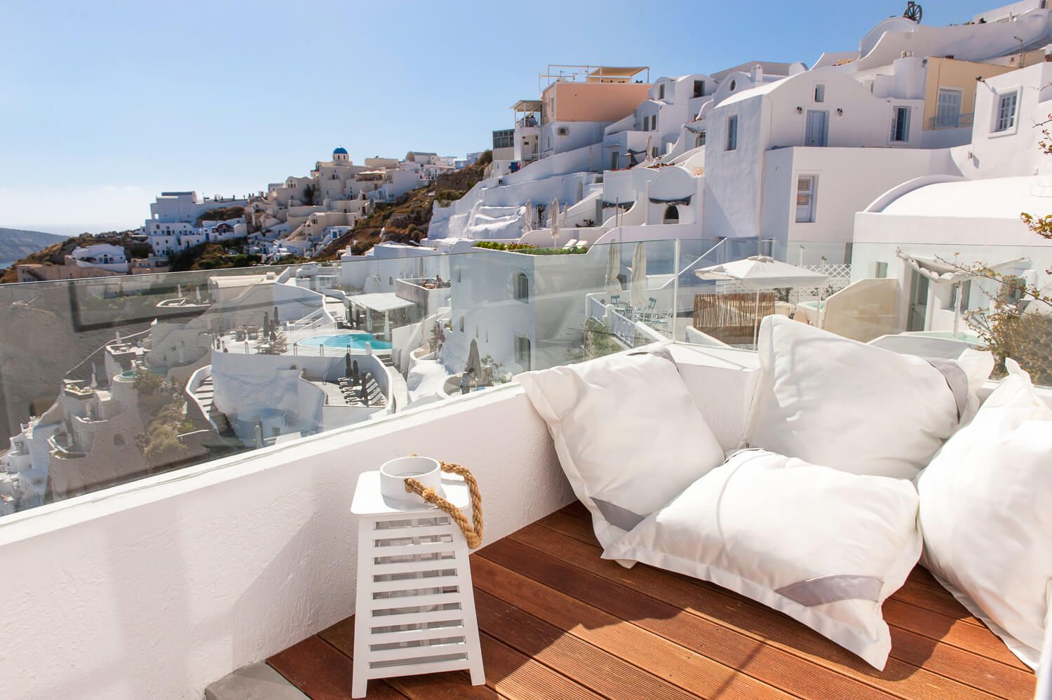 The striking visual drama of Oia village buildings on the caldera rim