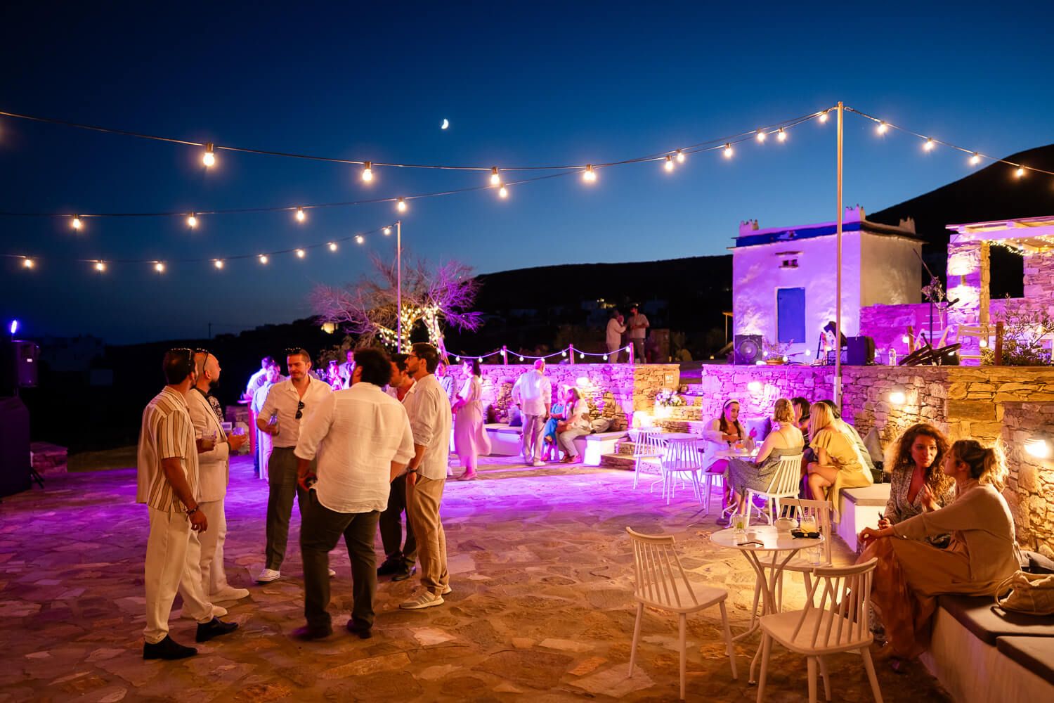 High-energy wedding party starting with traditional Greek island dancing