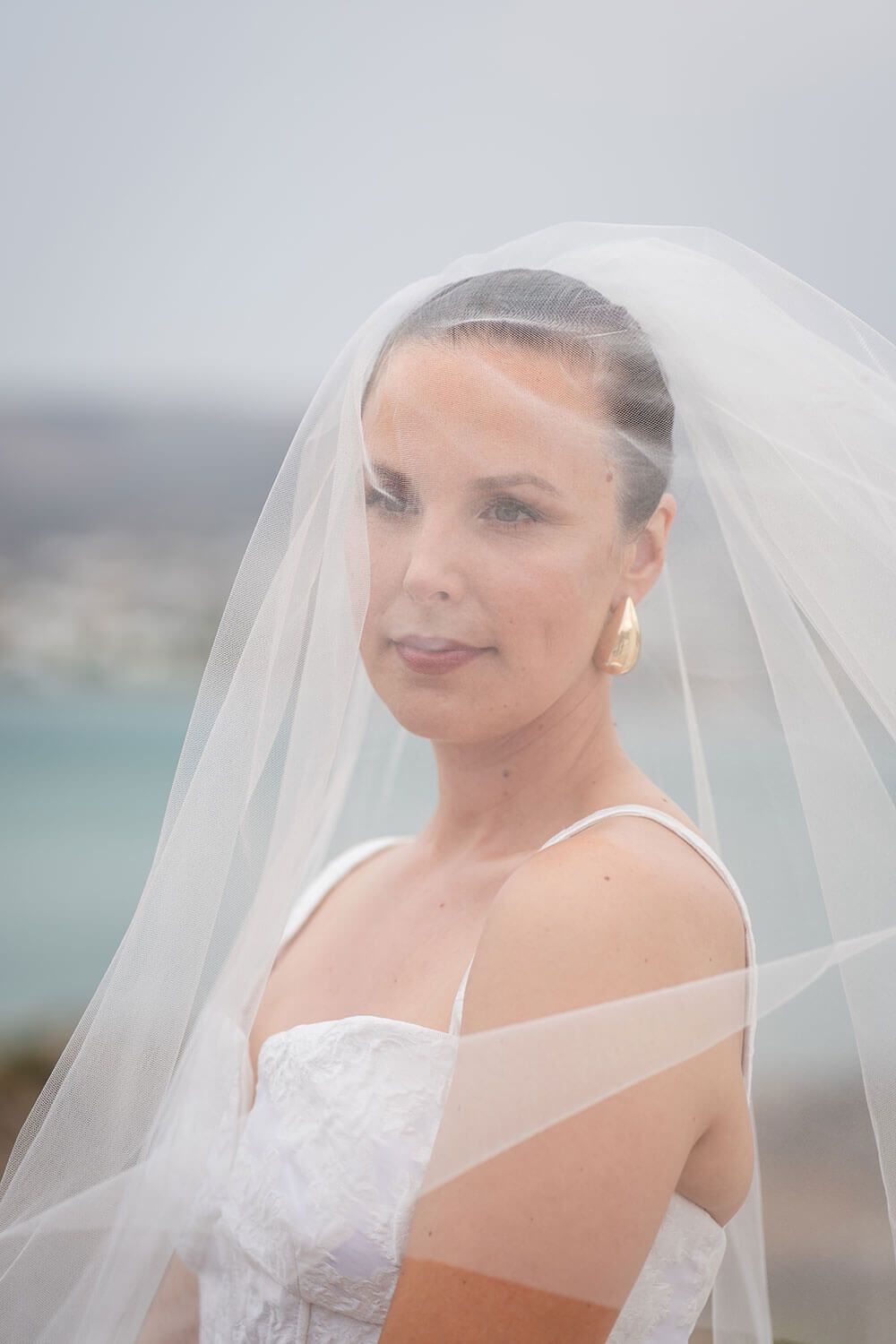 Bride smiling warmly while exchanging vows at her Paros elopement