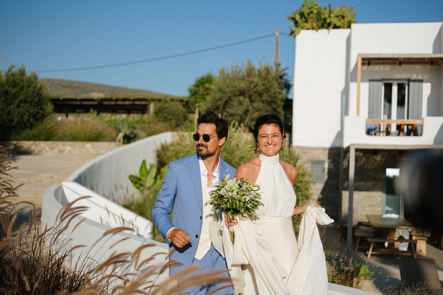 Unposed moments of bride and groom in the Cyclades