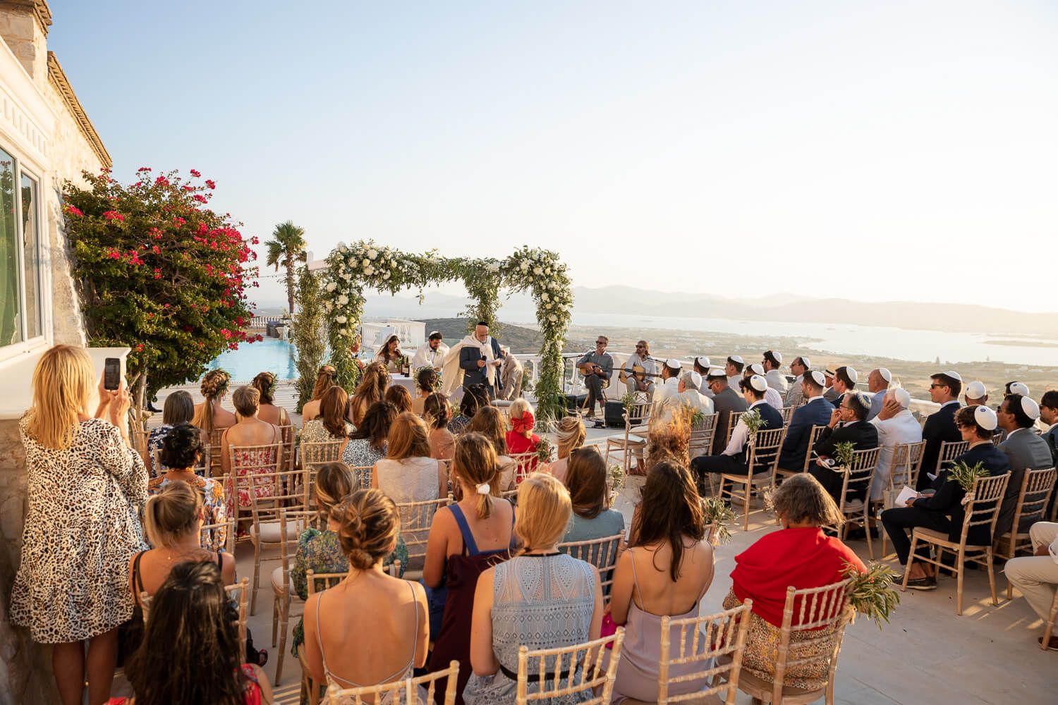 Wedding ceremony under the Chuppah with Aegean sea view in Paros