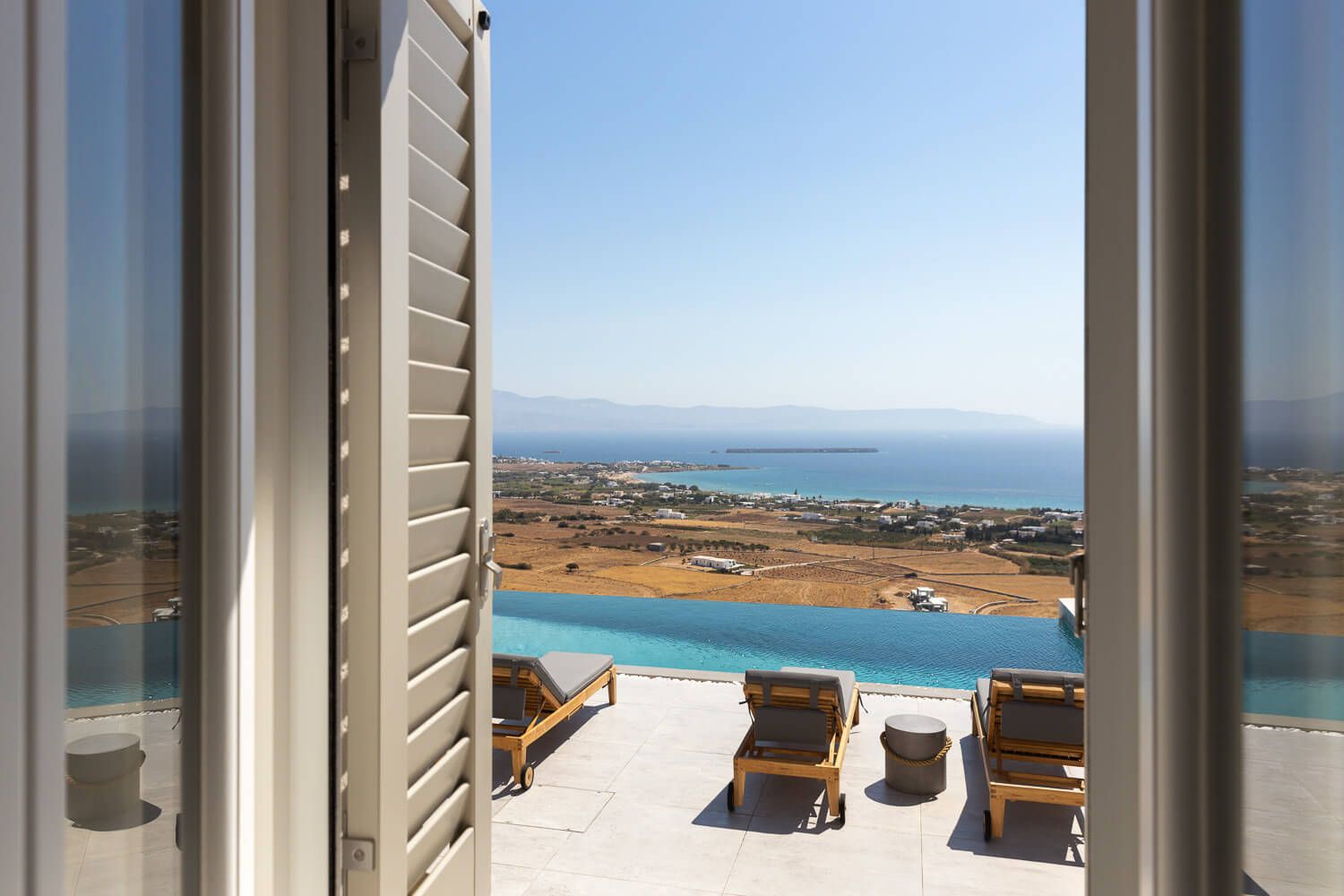 Serene master bedroom interior with a view to the pool