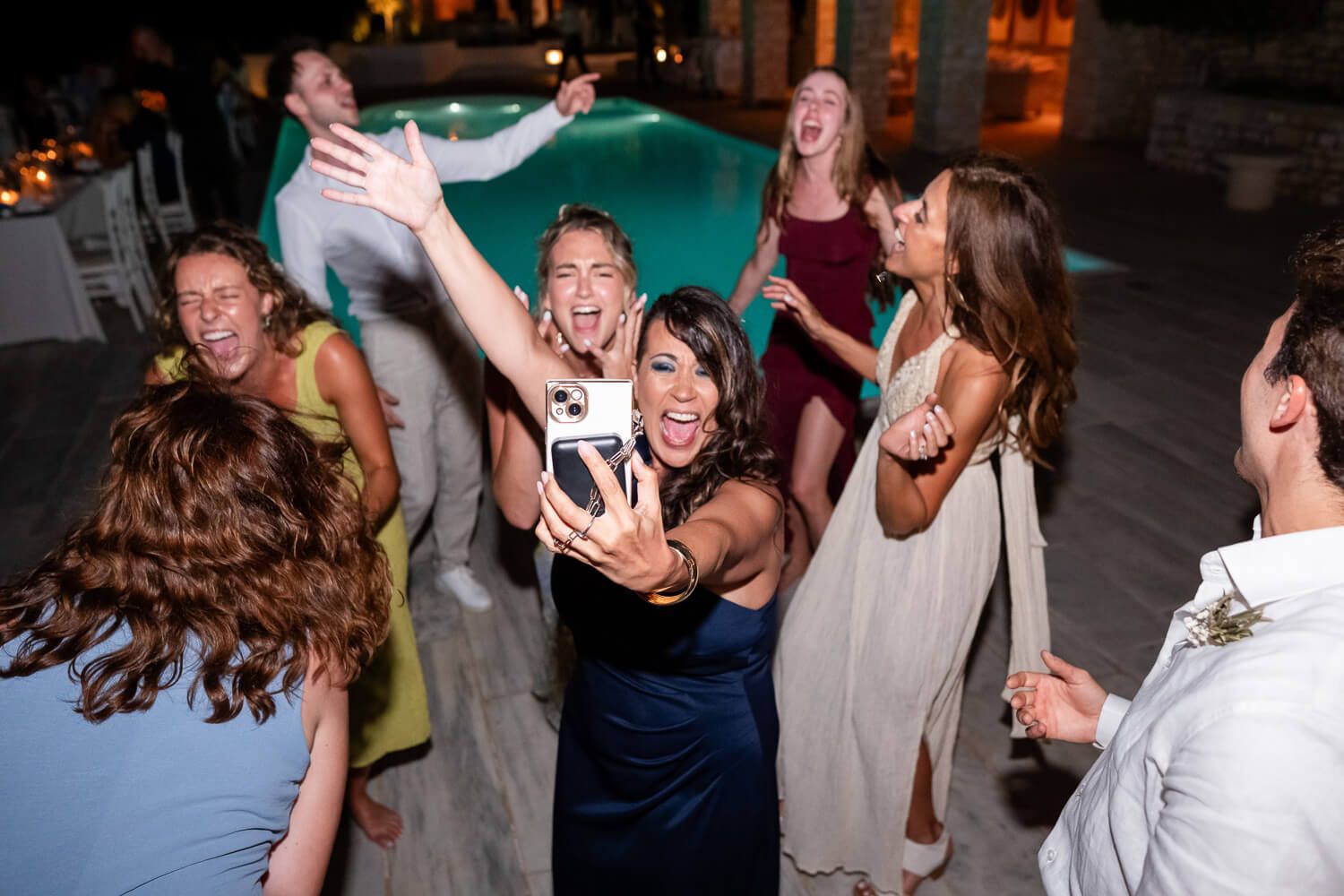 Relaxed nighttime wedding party celebrating timeless love in the Cyclades