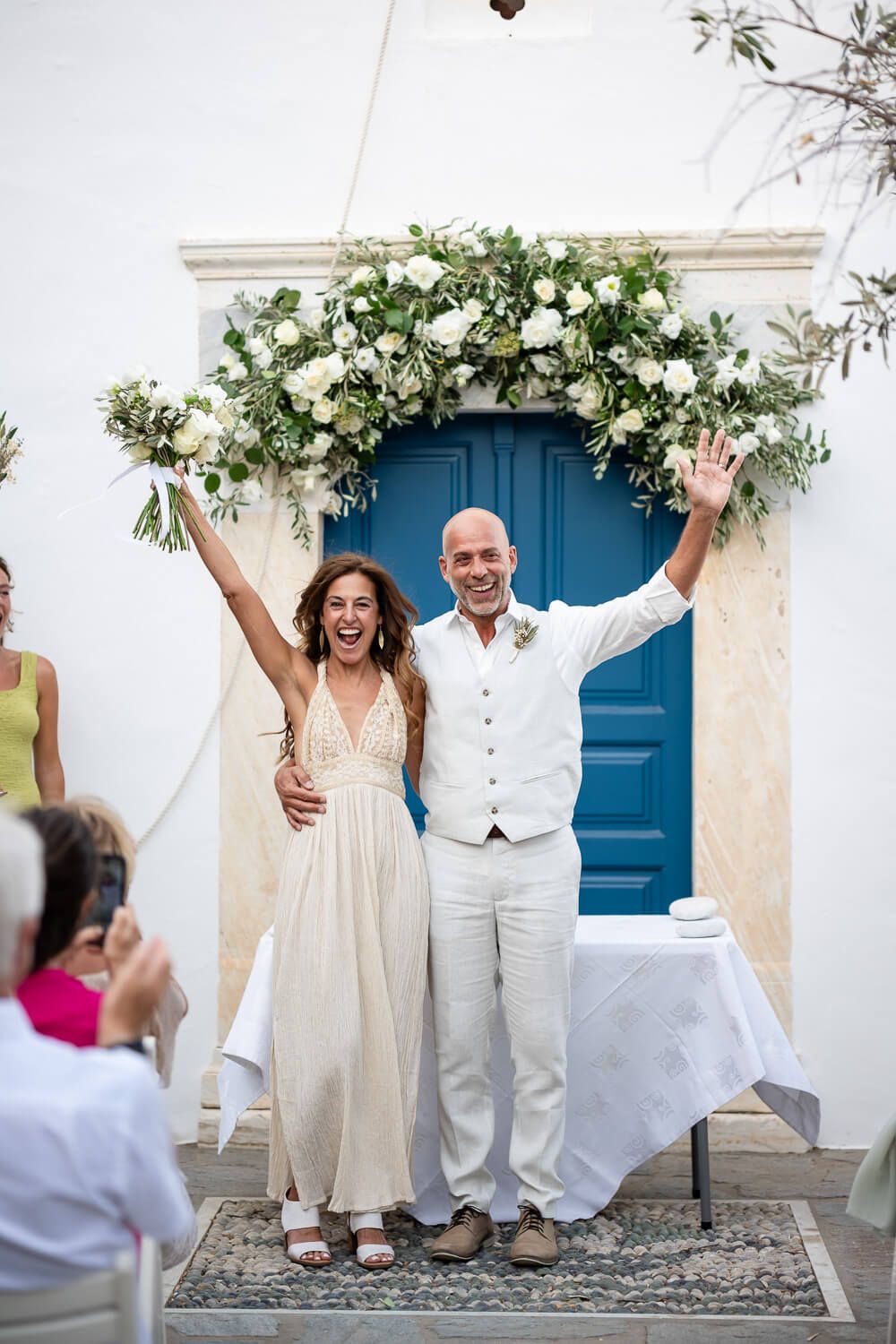 Joyful newlyweds walking together after their small wedding ceremony