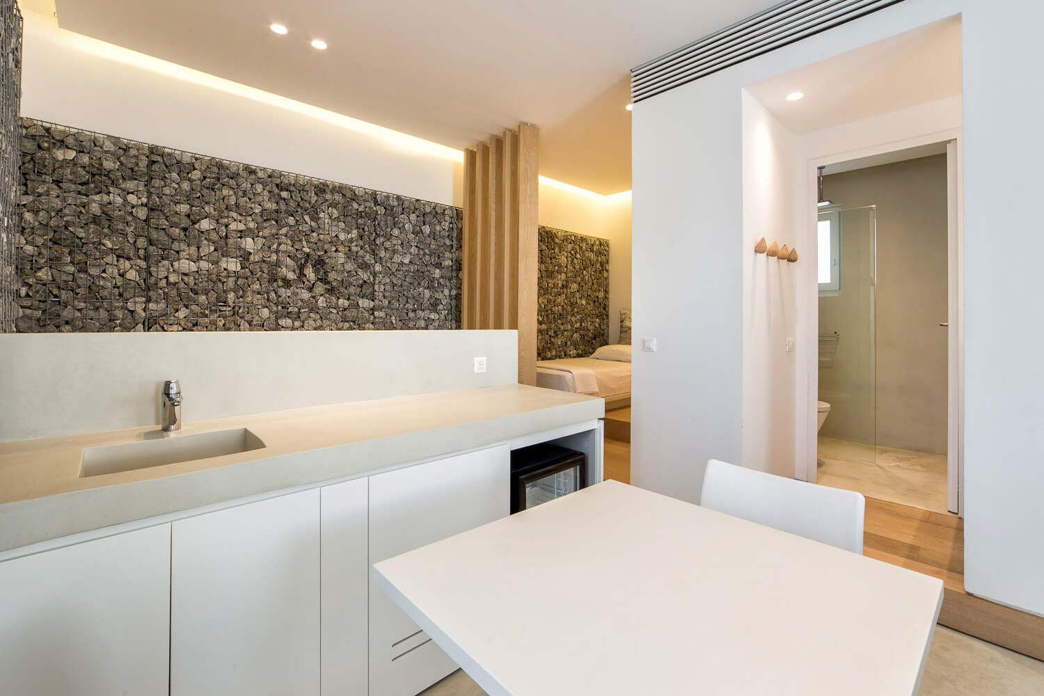 Minimalist interior design of a luxury suite at Relux Ios Hotel