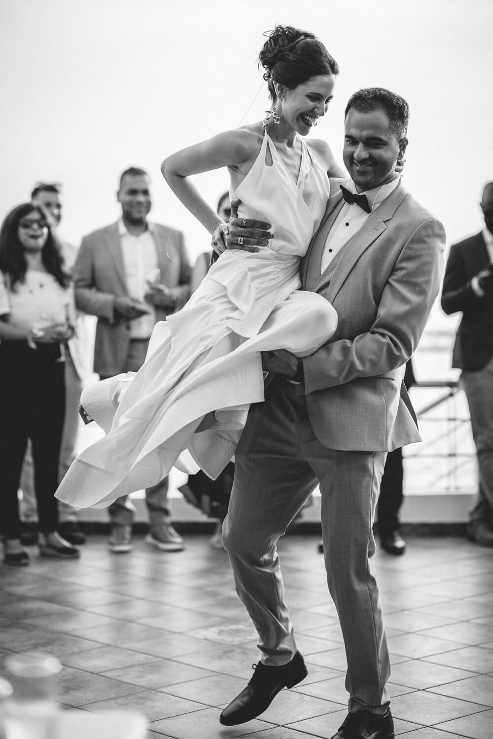 Newlyweds dancing in front of guests at Villa komito
