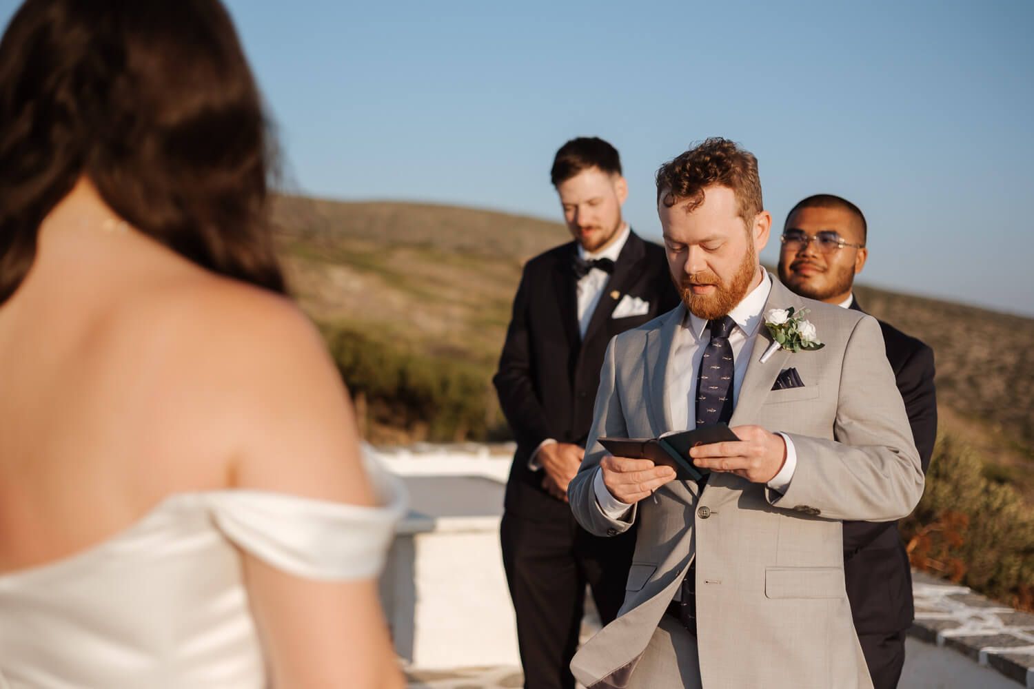 Emotional reading of vows at a private Greek chapel