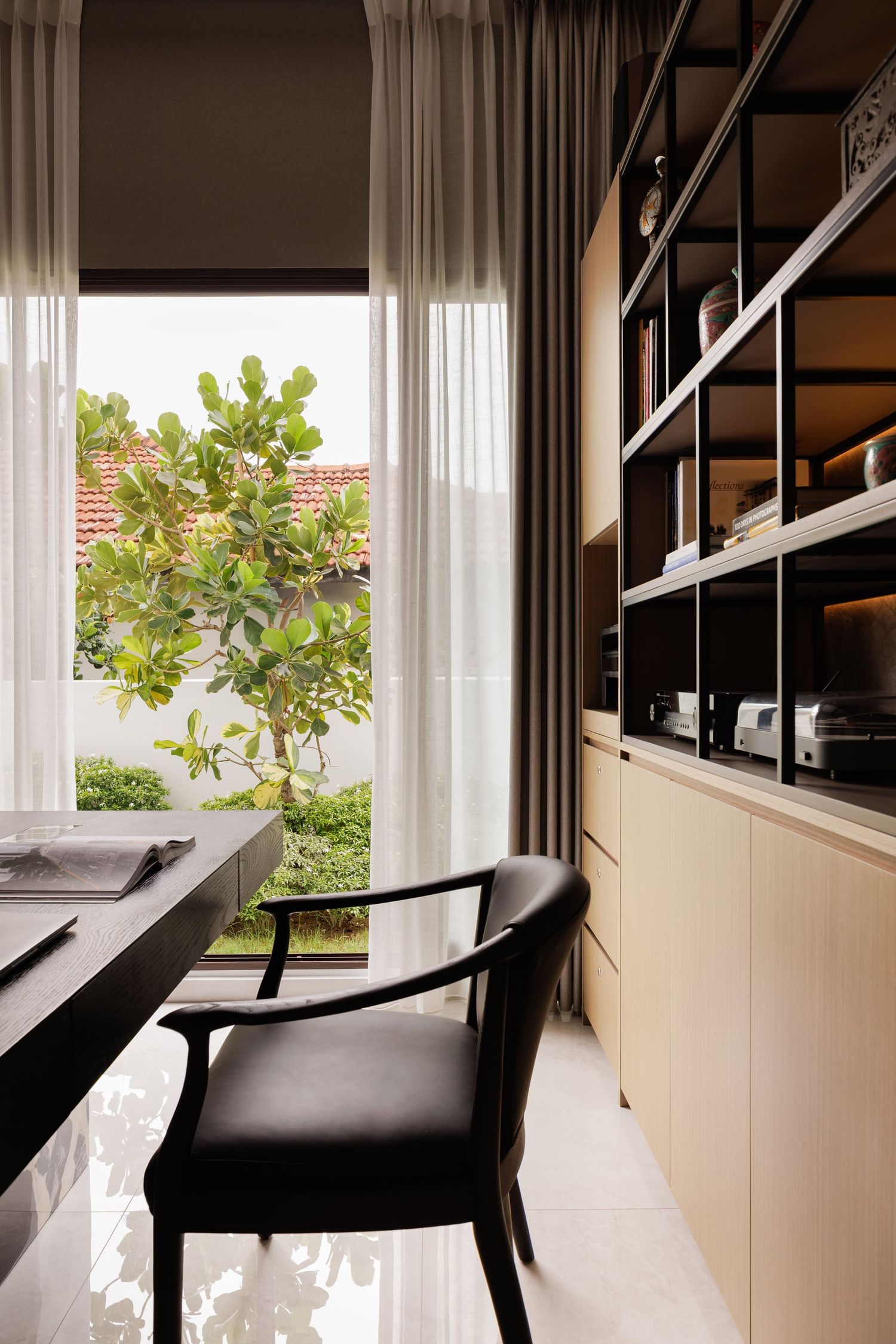 An artistic triptych shows a minimalist white balcony interior with black chairs and lush greenery visible through windows.