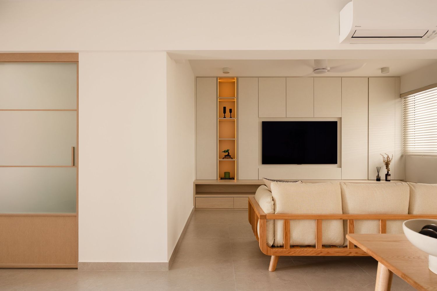 Modern white kitchen interior with wooden accents and minimalist cabinetry features sleek appliances and clean lines.