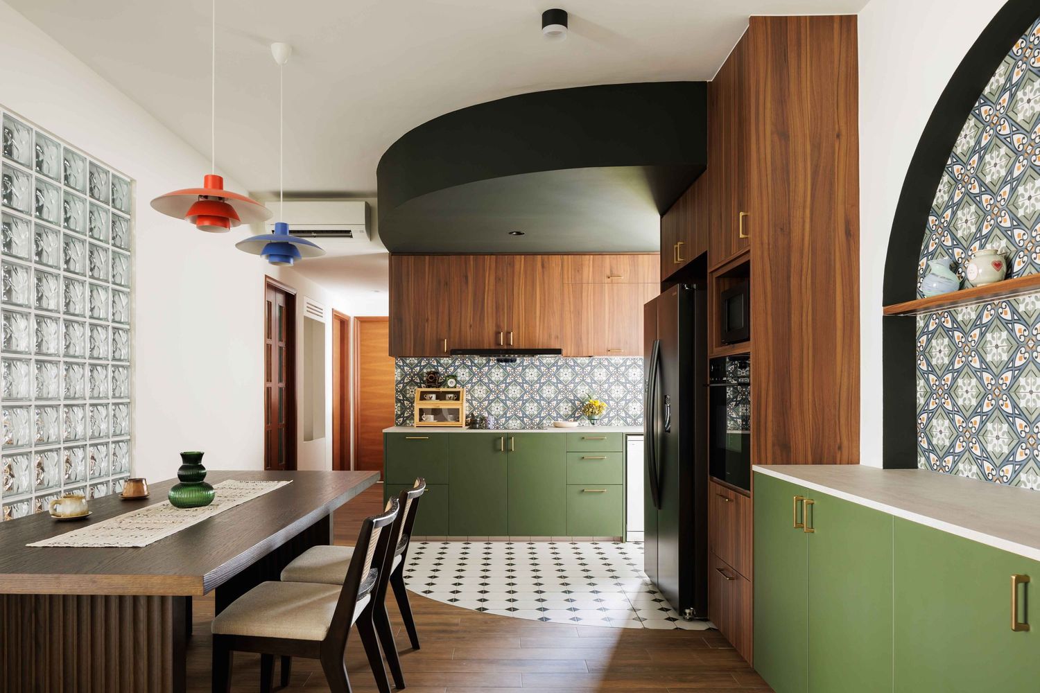 Modern kitchen interior with olive green cabinets, wood paneling, and patterned tile floor features glass block windows.