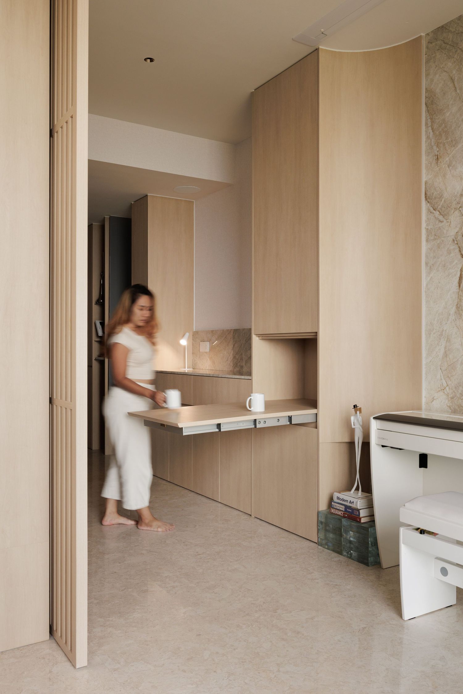 Sequence of interior renovation photos showing a partially completed bathroom installation with beige walls and flooring.