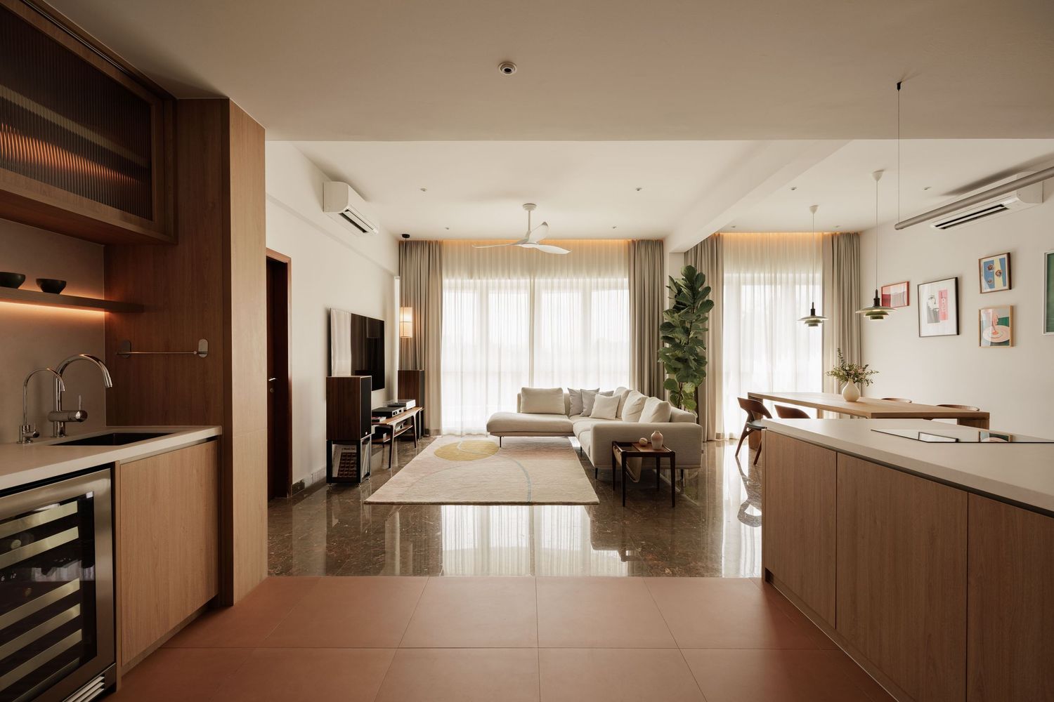 Modern apartment interior with white walls and wooden cabinets features minimalist design and clean lines throughout.