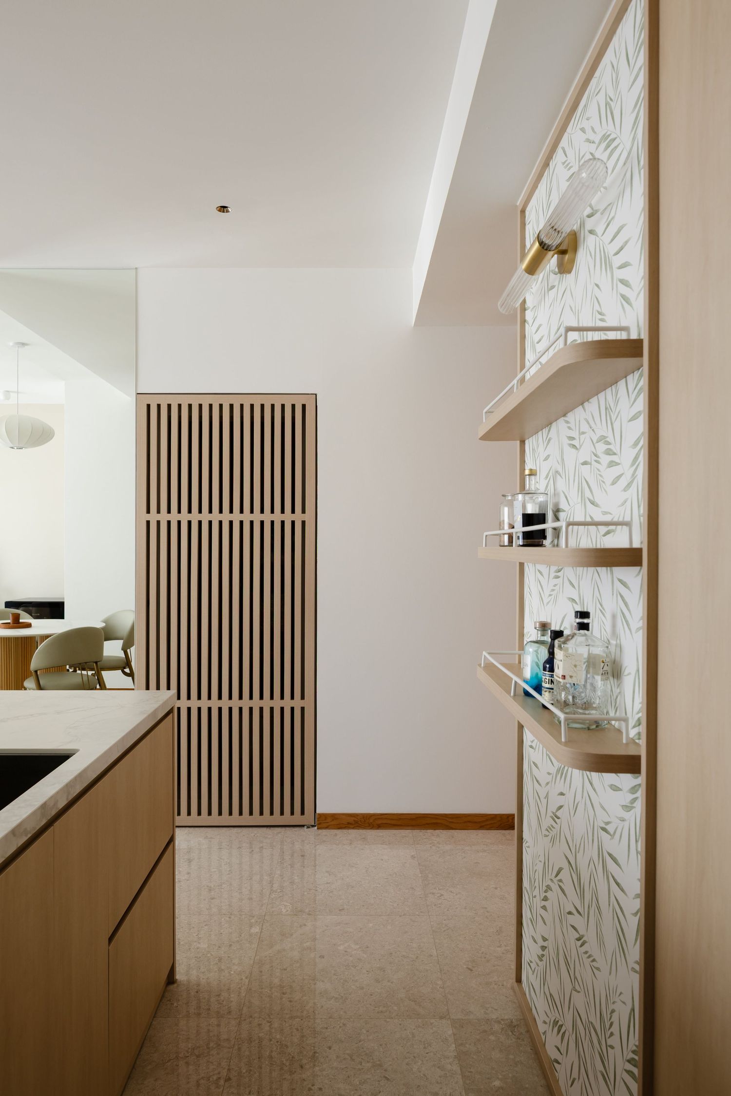 Modern white interior hallway with wooden shelving and slanted geometric wall panels creates a minimalist architectural design.