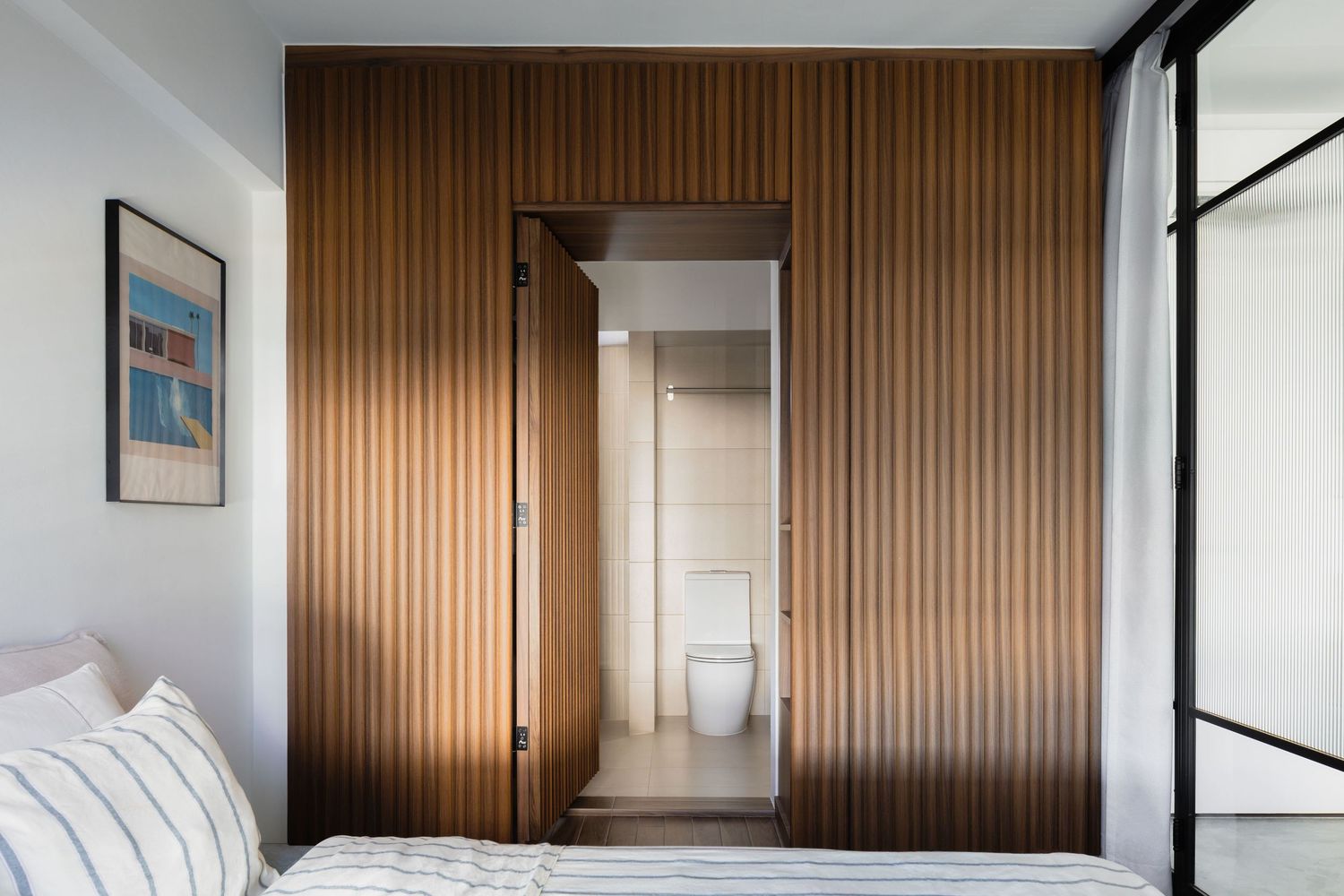 A series of modern wood-paneled interior spaces with clean lines and minimalist design creating a serene atmosphere.