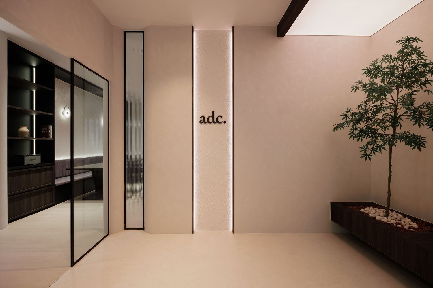 Modern minimalist interior design features sleek white walls, black accents, and natural light through large windows.