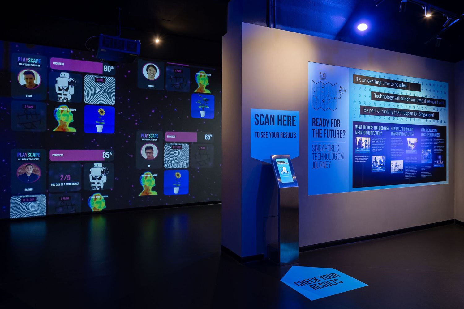 Interactive museum exhibit with digital displays, QR code scanner kiosk, and futuristic blue-lit technology timeline wall.