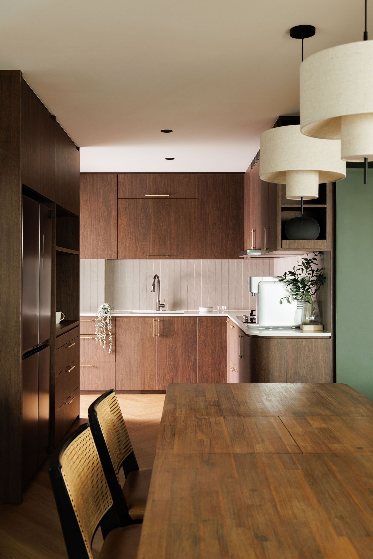 Modern open kitchen with dark wood cabinets and hardwood floors viewed from multiple angles in a panoramic sequence.